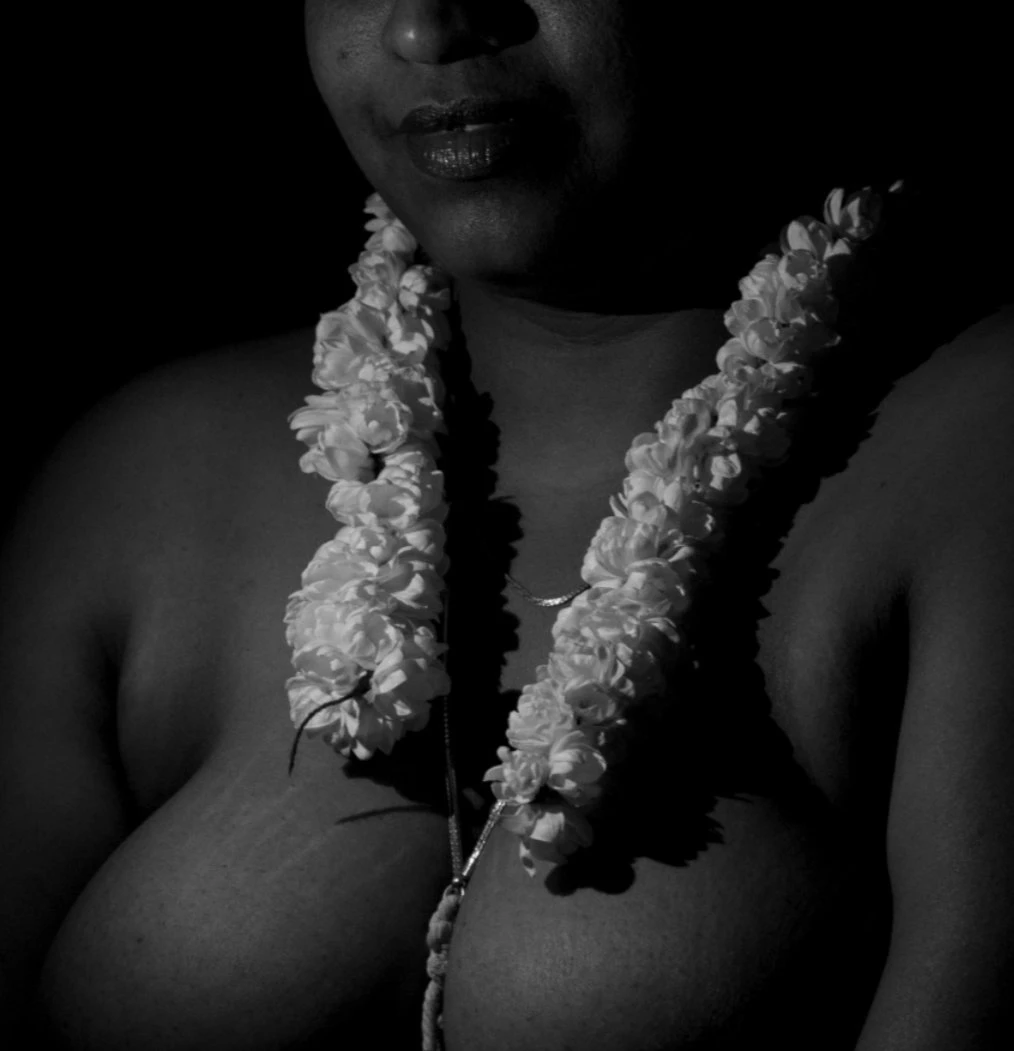 Exquisite Topless Desi MILF tantalizes with her big melons with jasmine flowers hanging over them