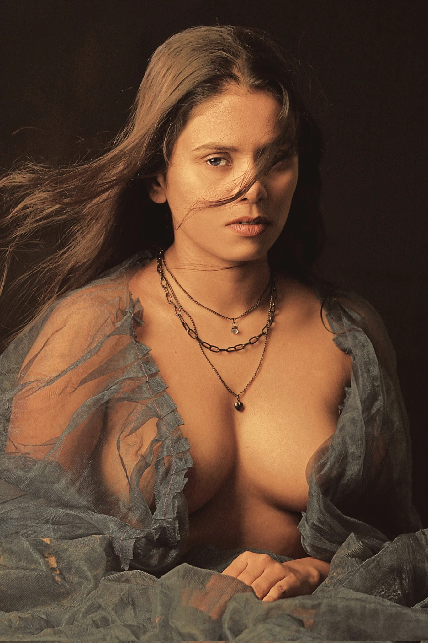 Desi model poses almost topless and shows her boobs through a transparent open lace dress