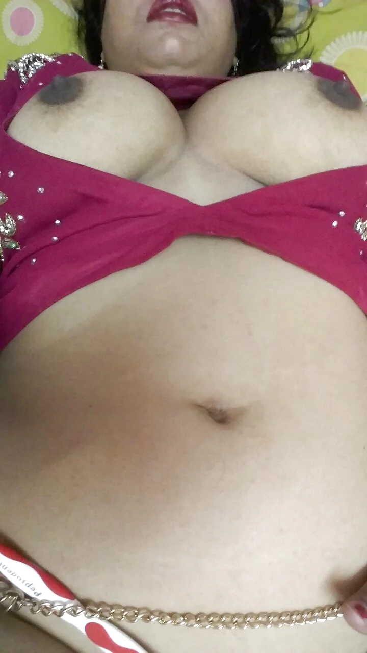 Desi MILF shows off her big boobs by opening her maroon blouse without bra