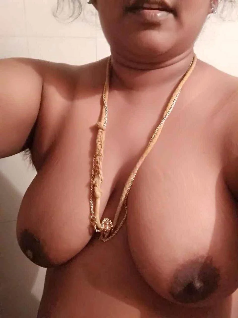 Topless MILF Desi wife leaves you speechless with her topless big knockers and wearing only her mangalsutra