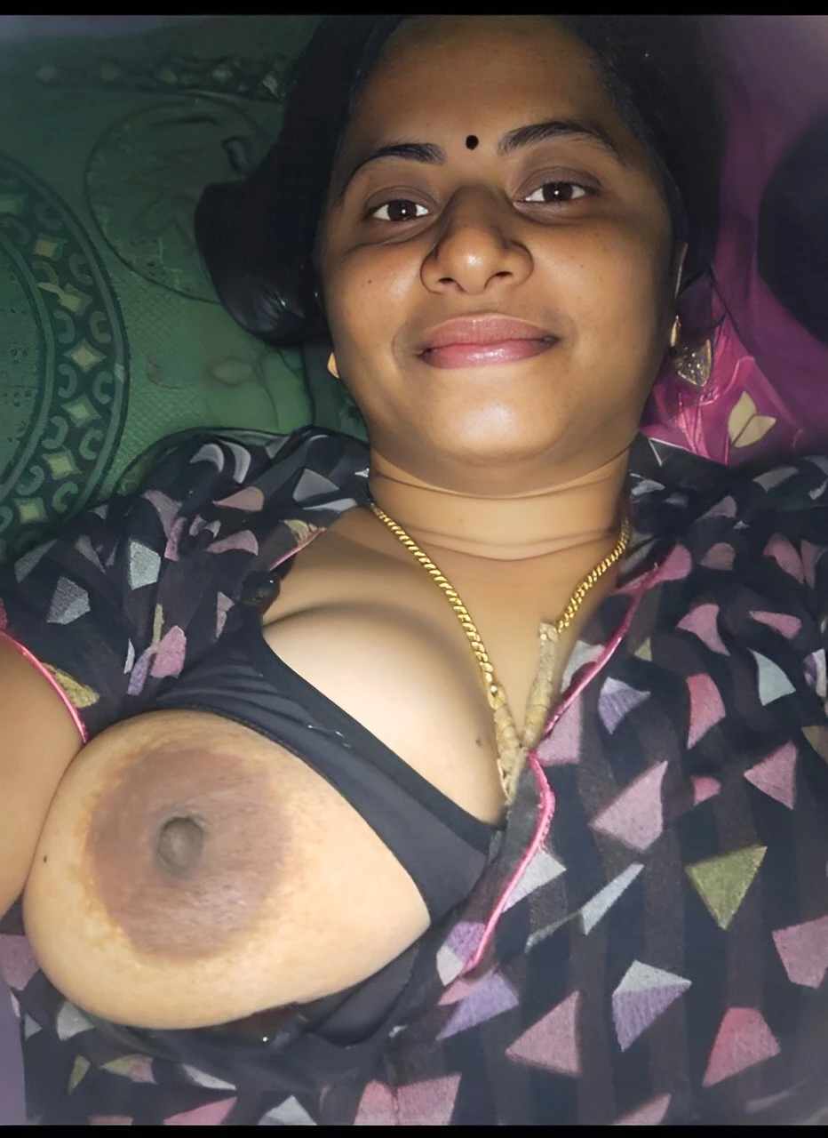 Desi wife shows one of her topless big boobies by taking it out of her feeding bra and taking a selfie