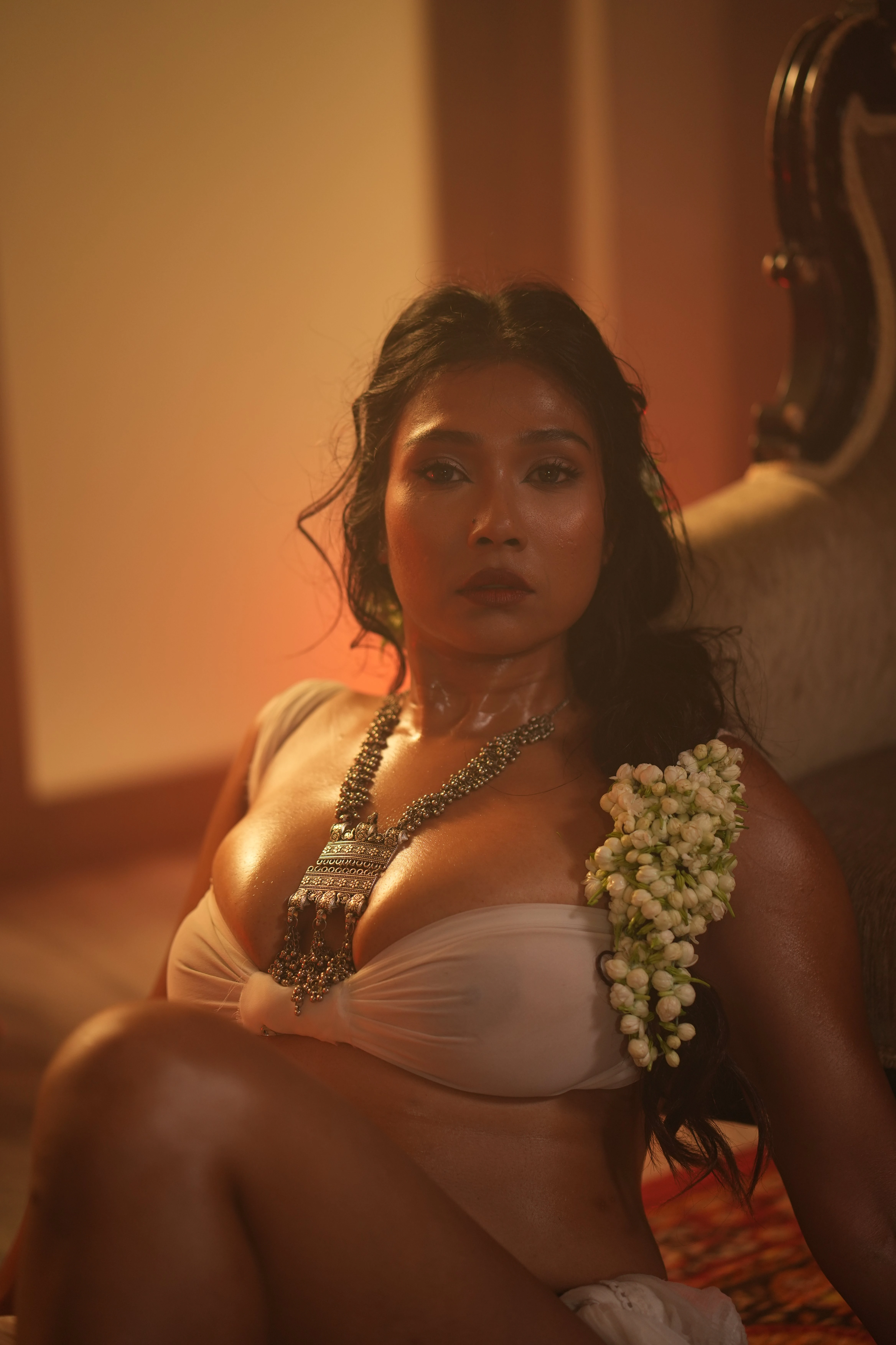 Sultry Desi MILF goddess adorning jasmine flowers flaunts her big boobs in a thin breast cloth and clearly shows her nipples