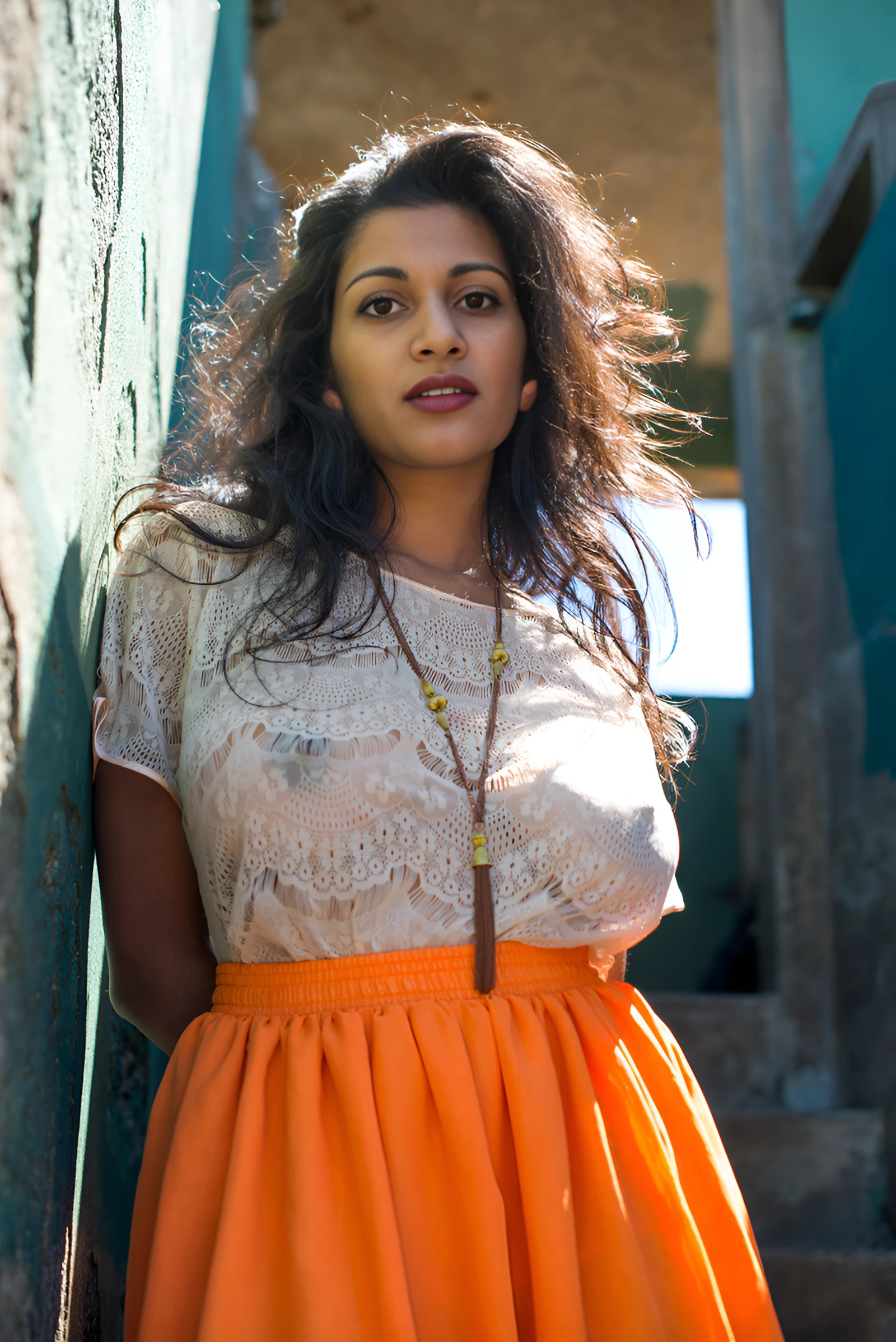 Desi model showing her boobs and erect nipples through a white lace tops and in an orange skirt