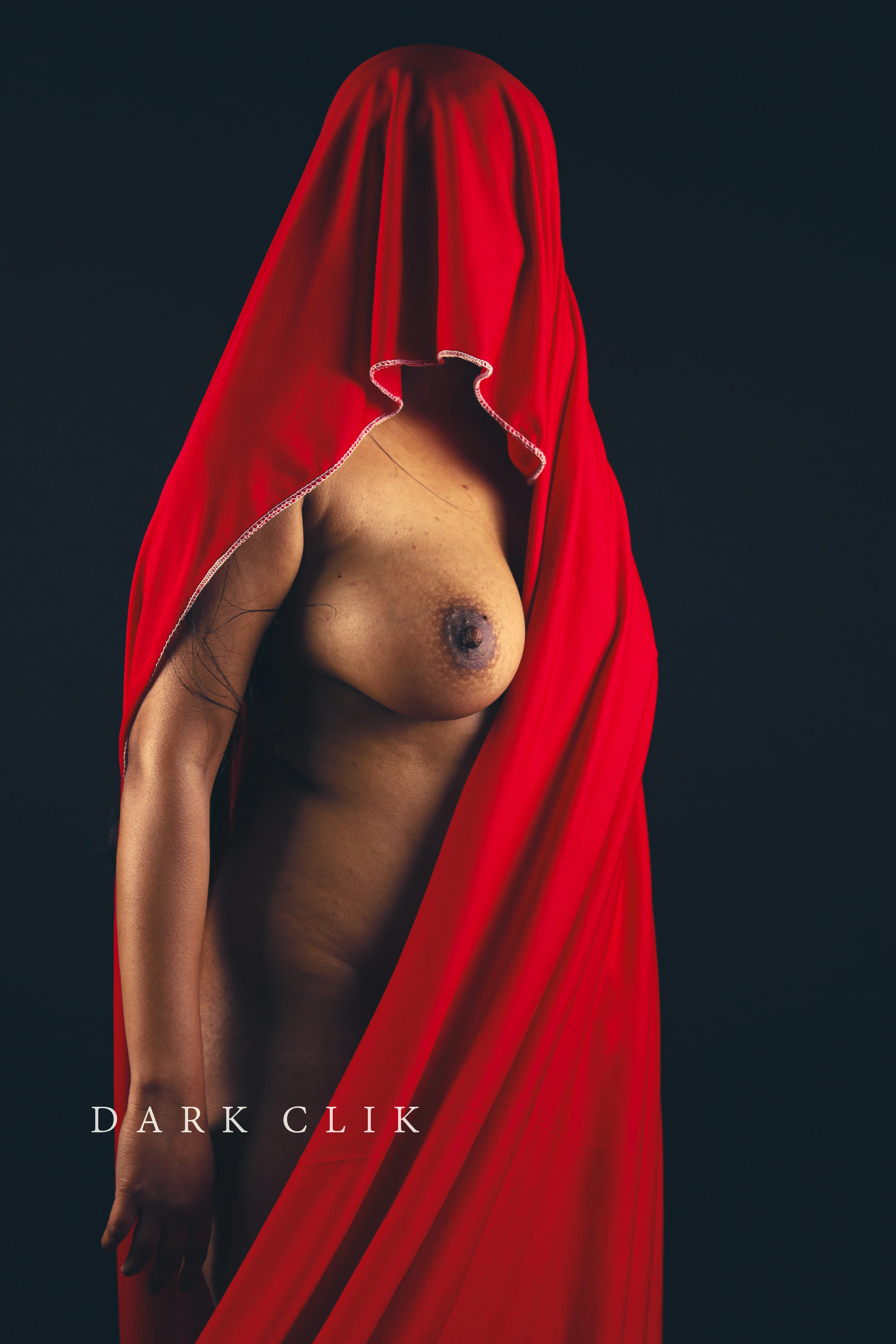 Desi MILF showing her big sexy big boobs and naked side body while covering herself partially with a red saree