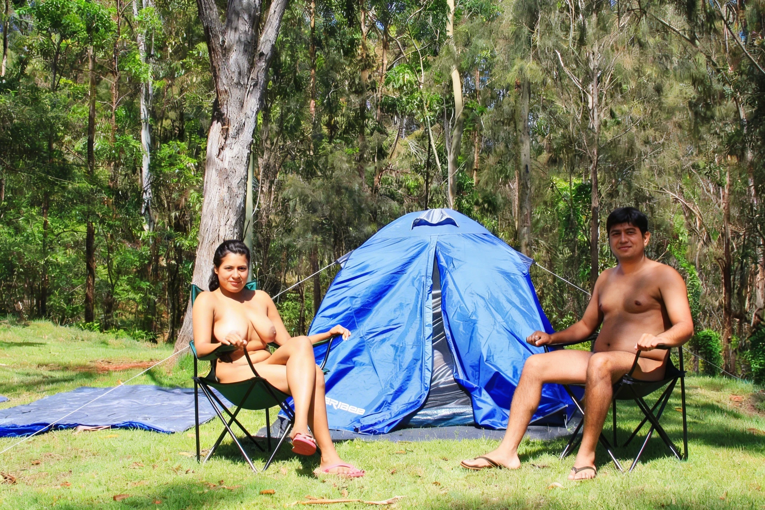 Naked Desi MILF sitting on a camp chair with her naked husband in outdoor in a forest