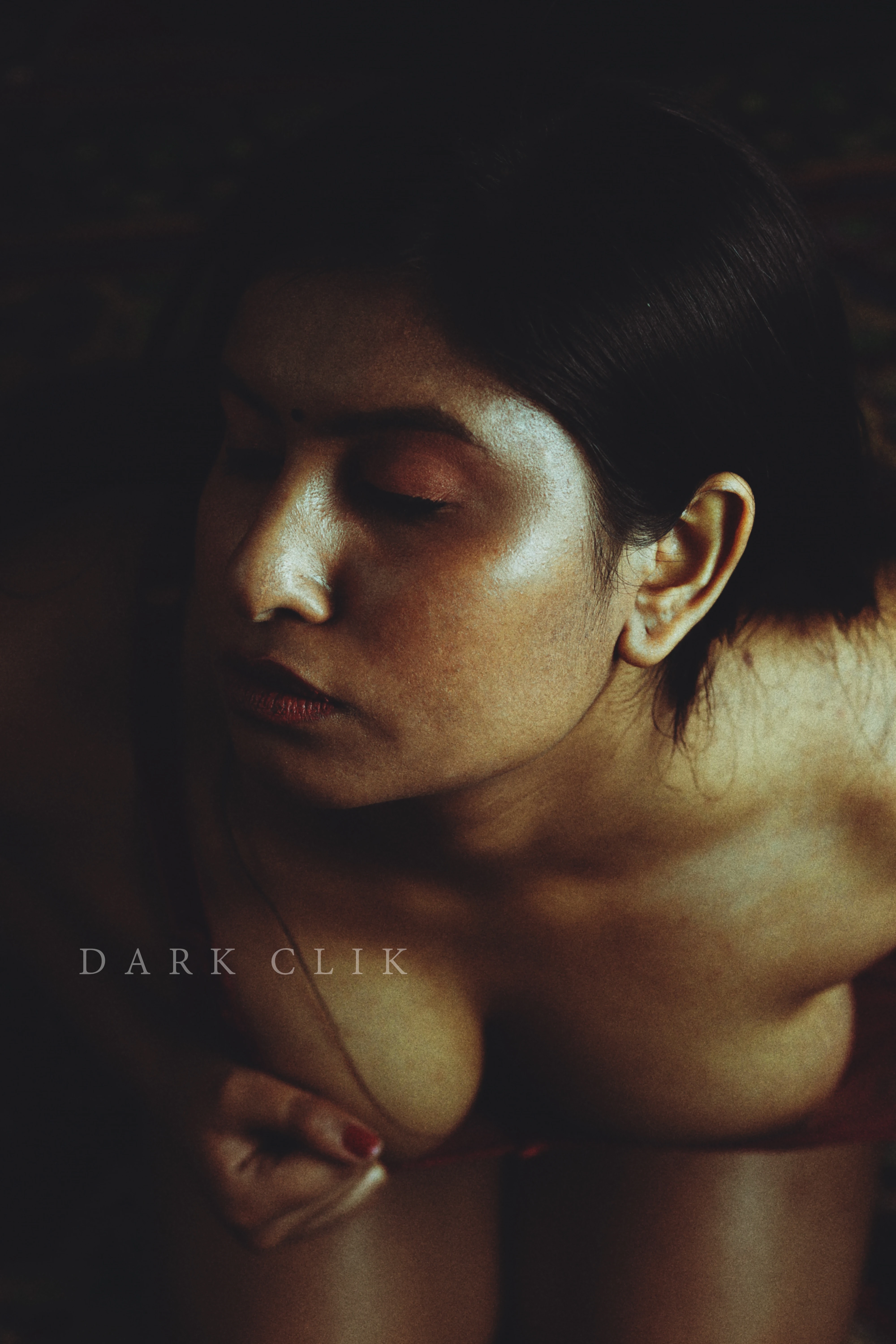 Desi MILF pressing her big boobs on the floor in an erotic tinted photo shoot