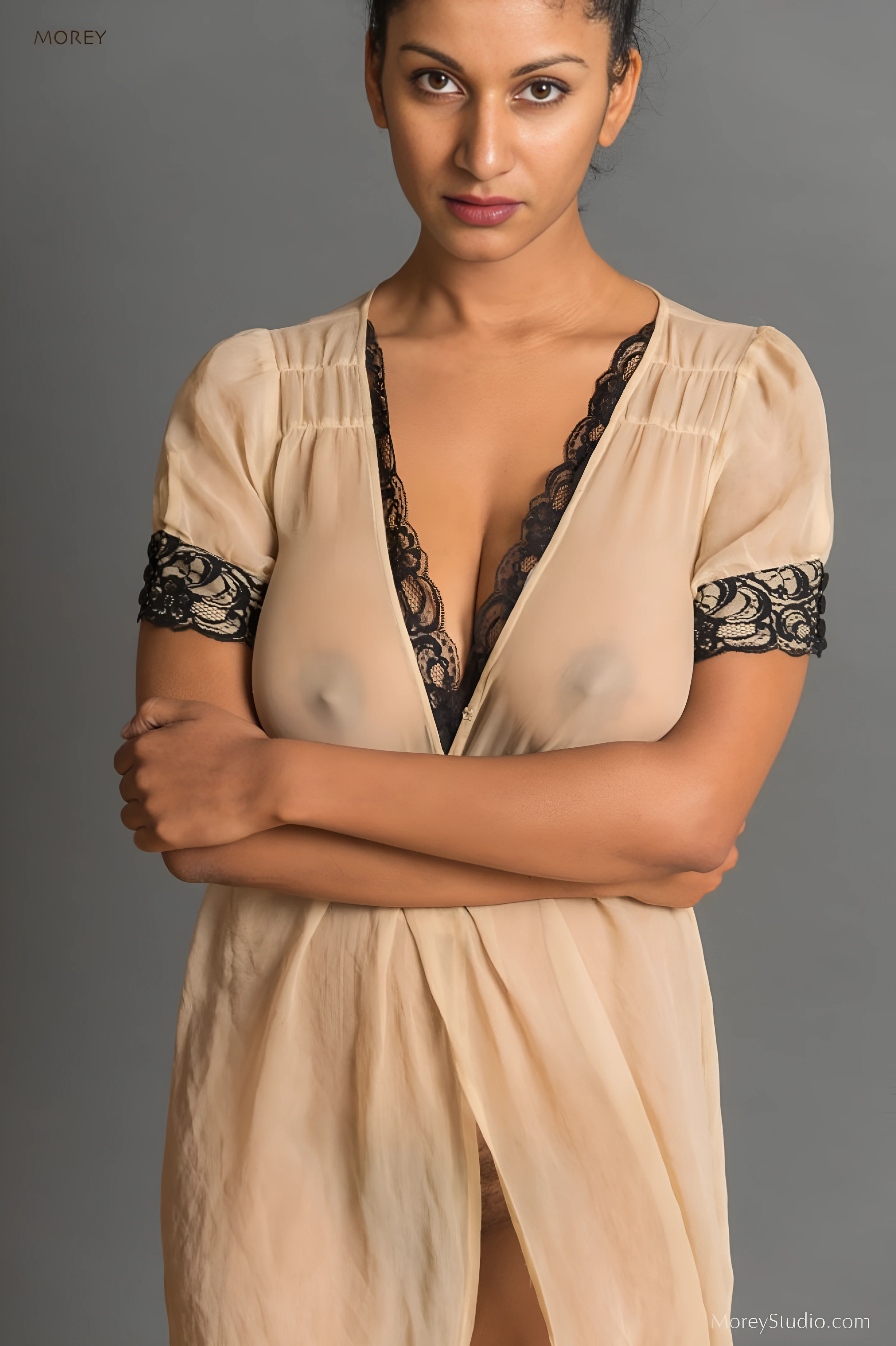 Desi model wearing a thin cream transparent long dress and showing off her big boobs and nipples clearly