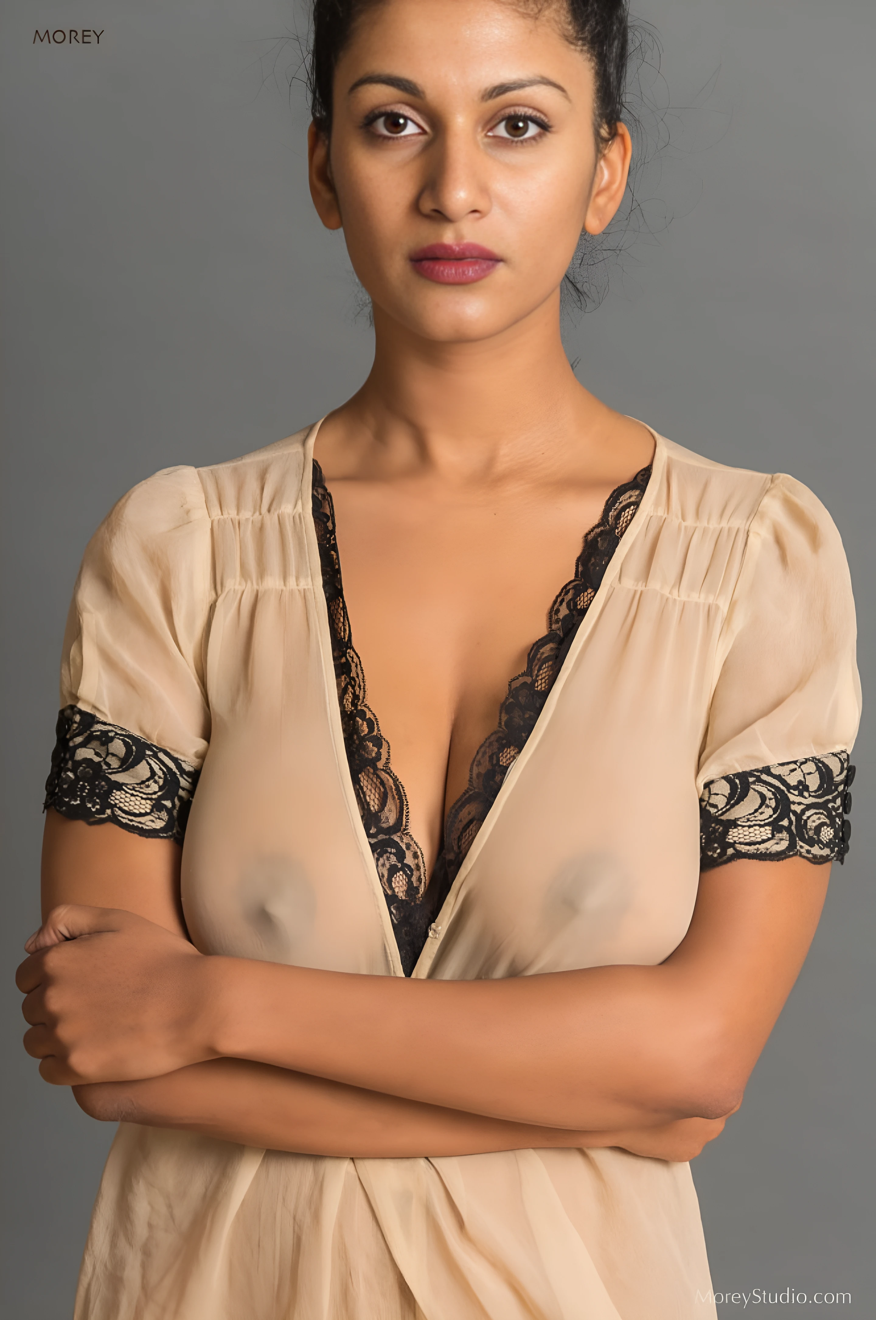 Desi model wearing a thin cream transparent long dress and showing off her big breasts and nipples clearly