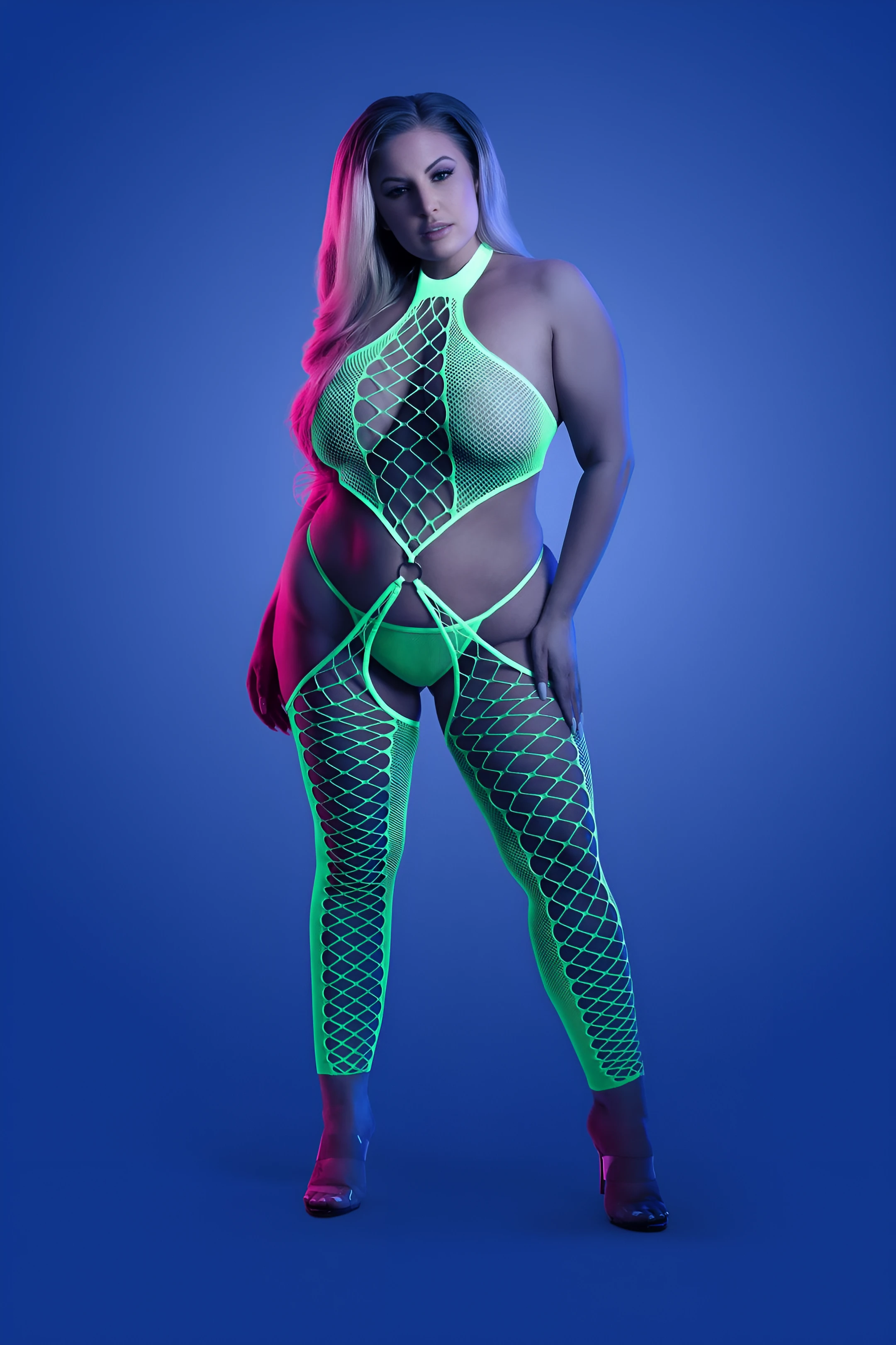 BBW model wearing a sexy neon green captivating halter bodystocking and showing her braless boobs through it