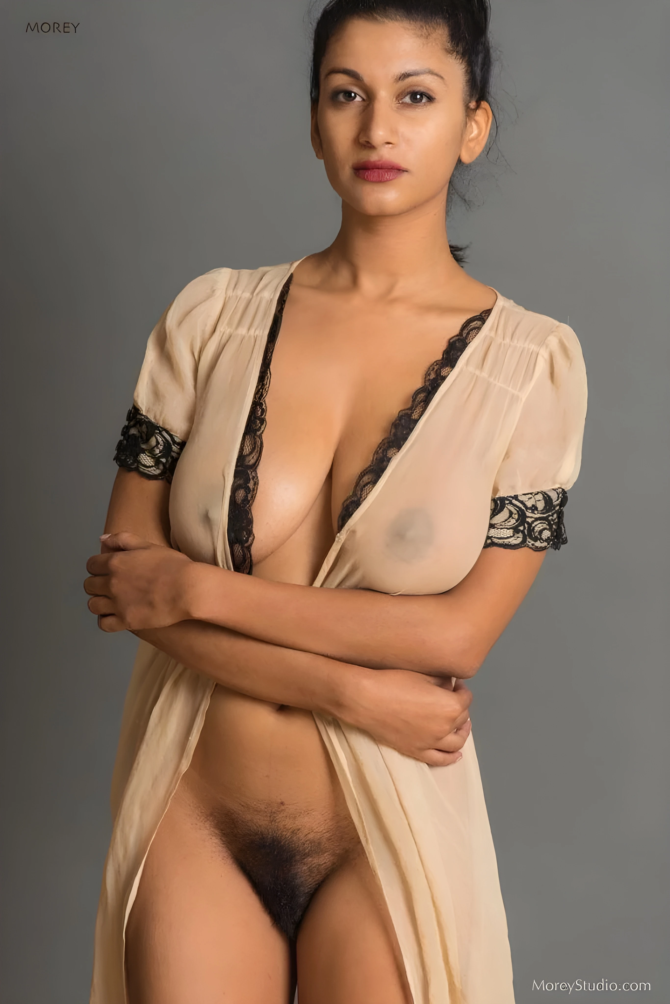 Desi model wearing a thin cream transparent long dress and showing off her big boobs and nipples and hairy pussy