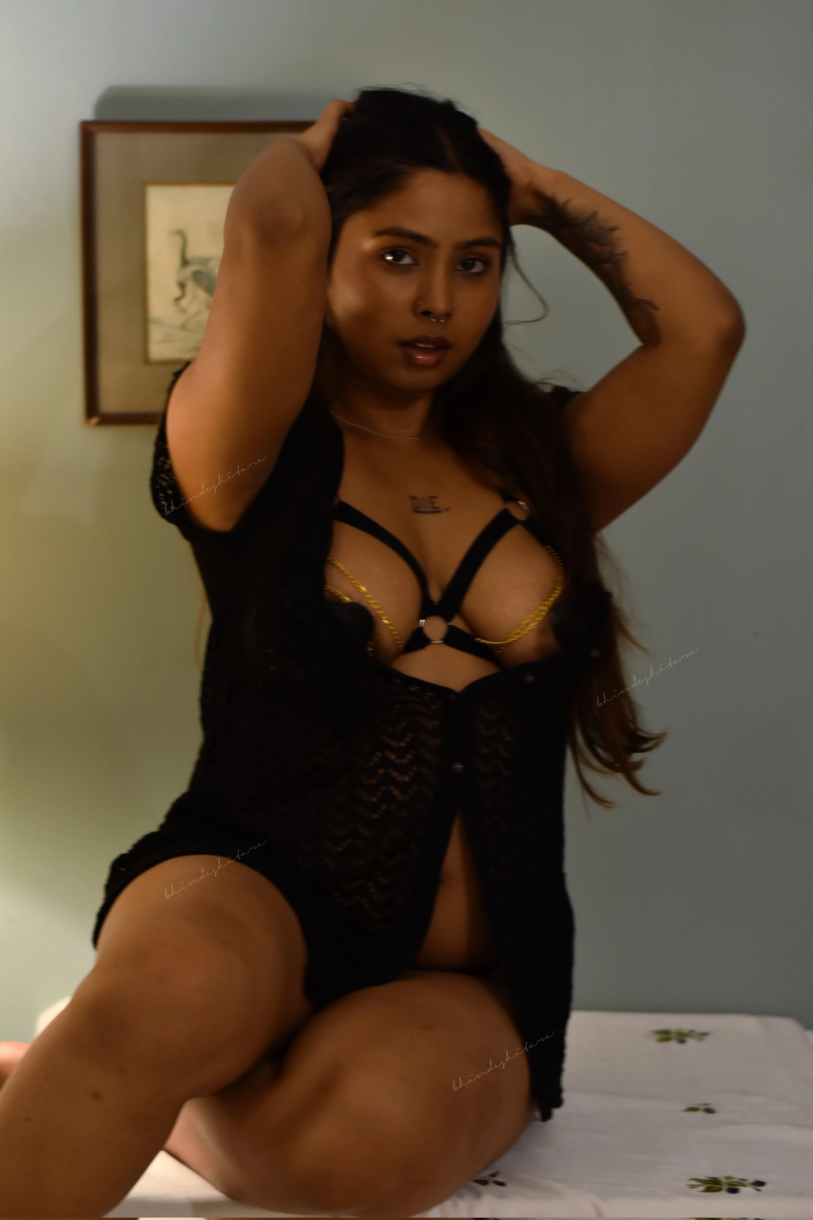 Desi milf in black lingerie posing seductively displaying her big tits with gold chains