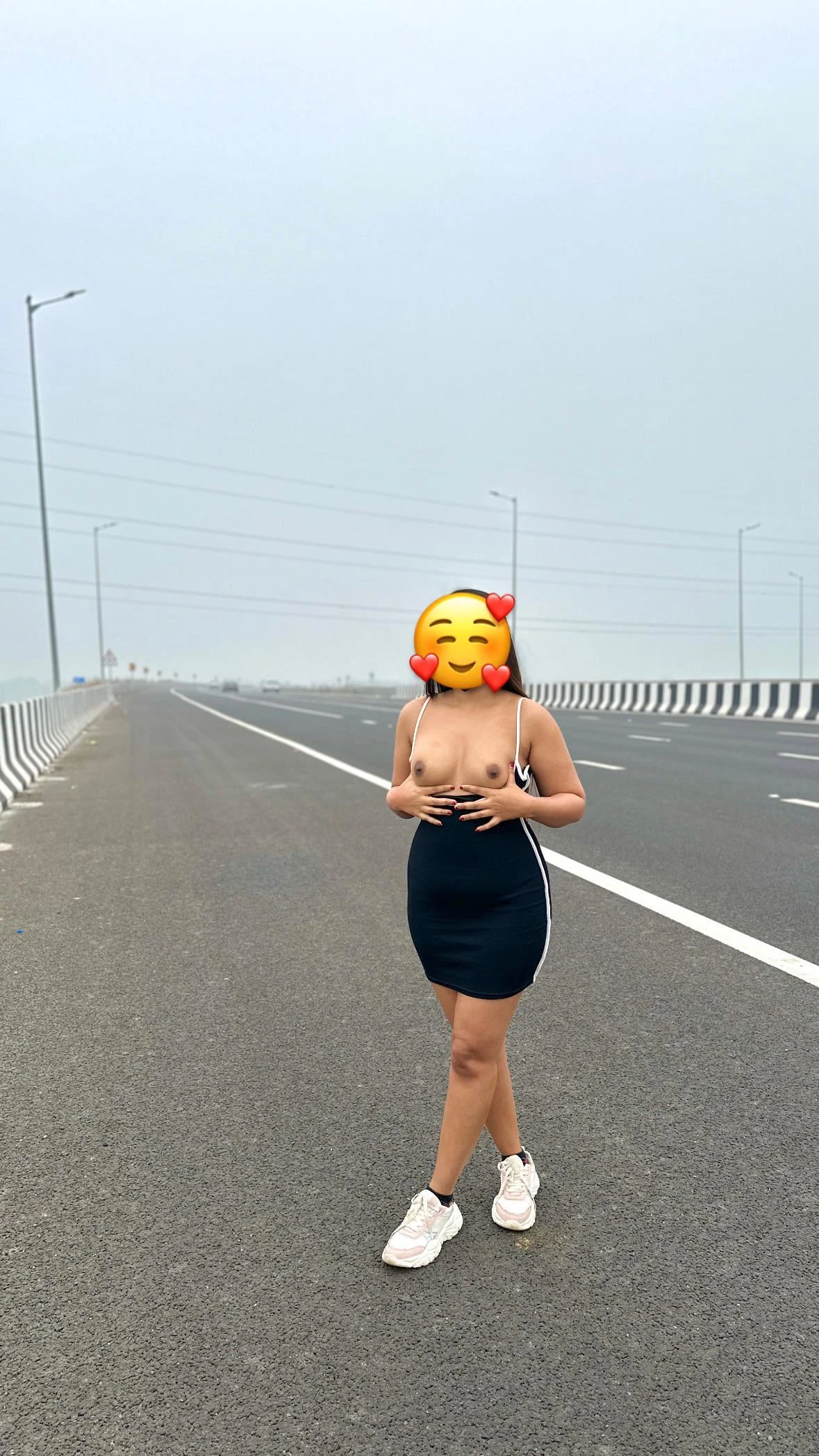 On the open highway, Desi lady sheds her inhibitions, revealing her bare breasts wearing only a black shorts