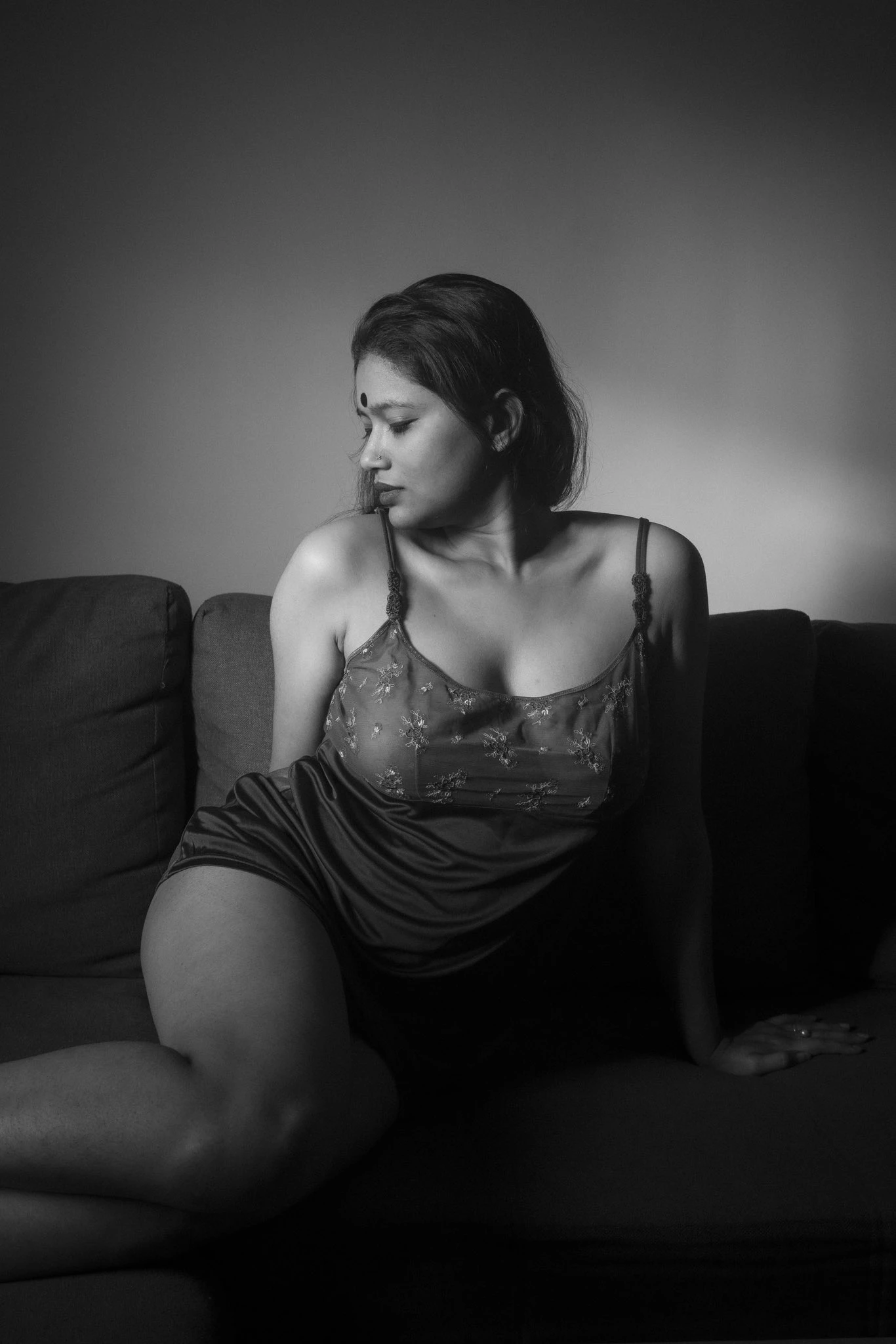 Bangladeshi MILF Afsana Faiza in sheer slip dress teasing full C-cup tits with dark areolas through fabric on sofa