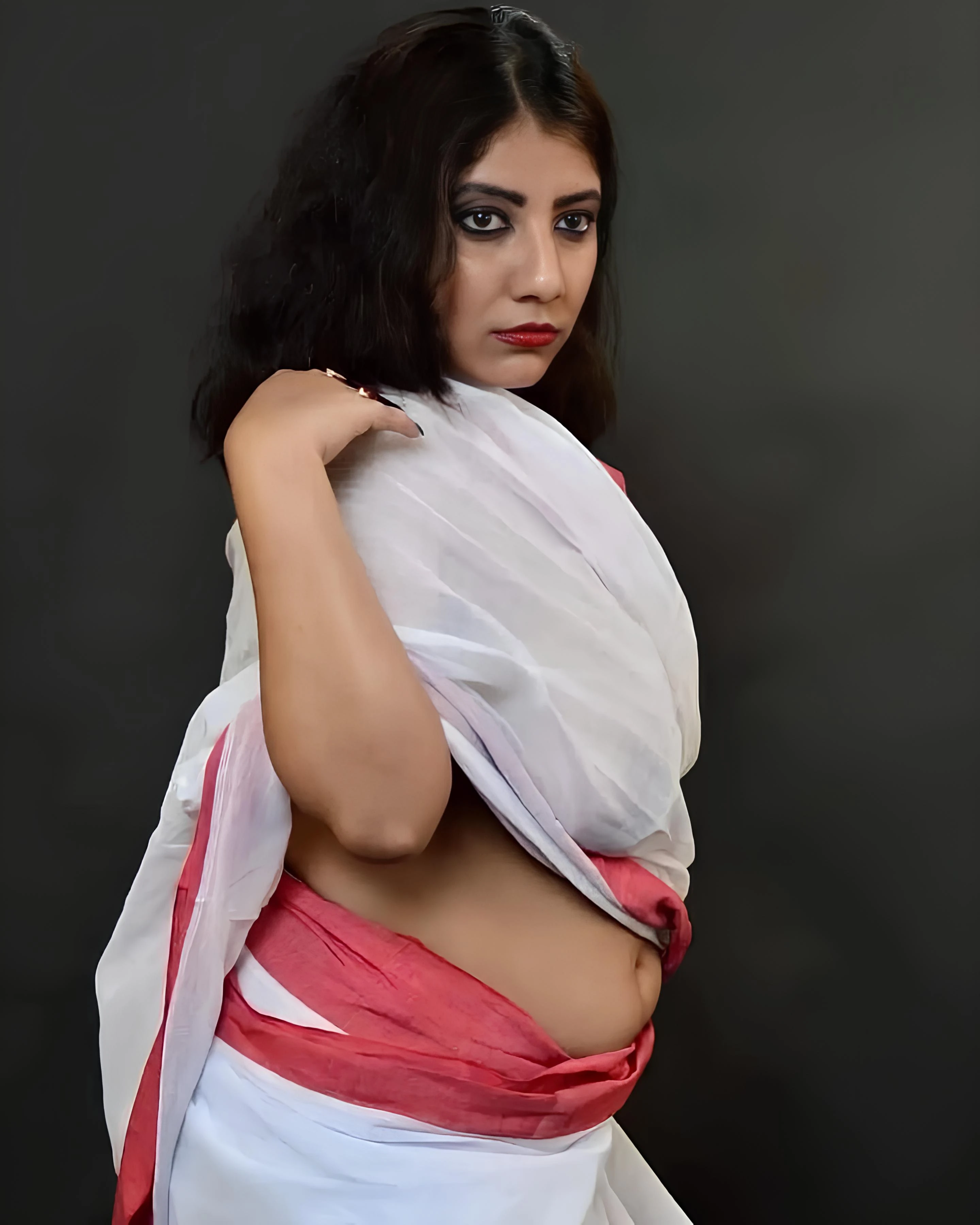 Busty Rai Ghosh posing braless in a thin white saree displaying her naked perky breasts and smooth belly