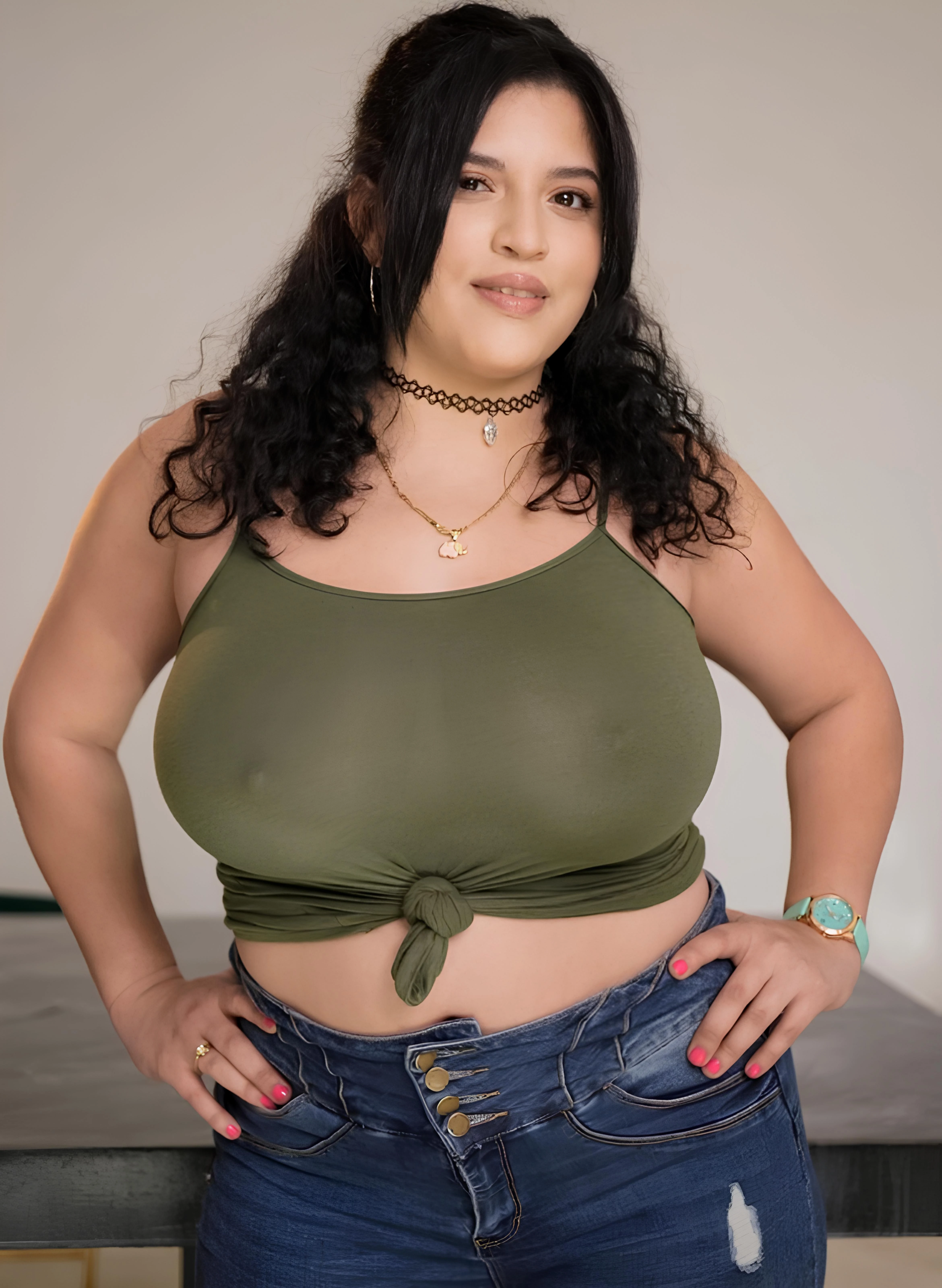 Gabriela Lopez in a knotted green thin tank top showing her huge breasts and erect nipples