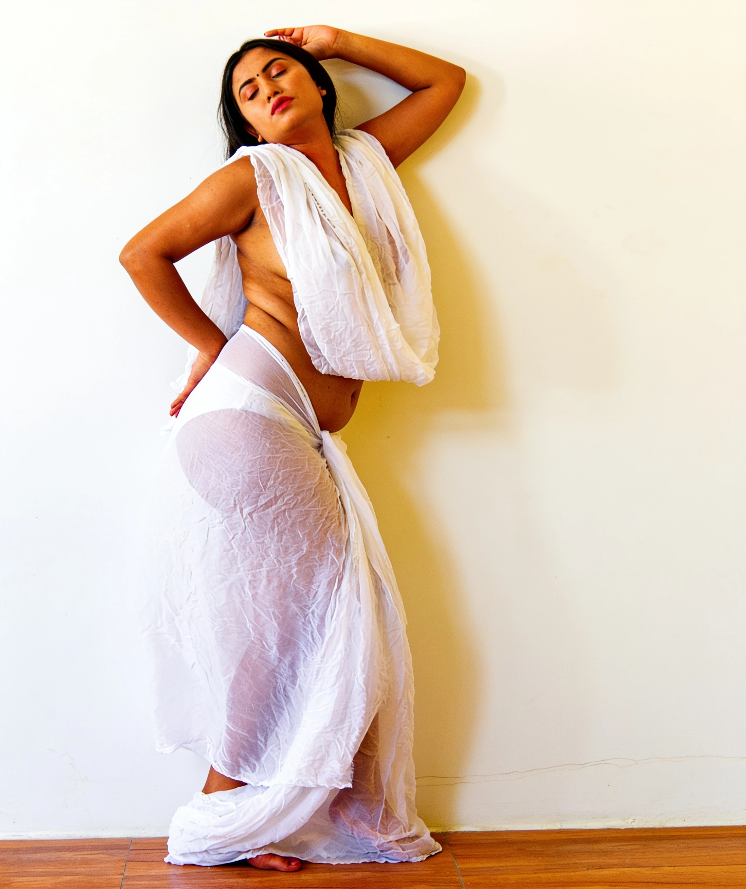 Desi model Priyanka Kalyana with sheer white garment revealing body contours