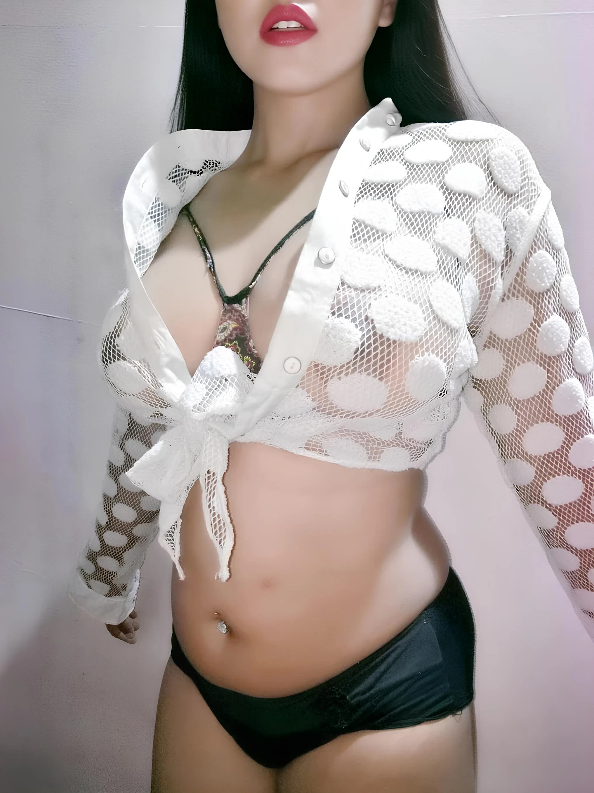Desi MILF poses in a sheer white cardigan showing her large breasts and dark brown nipples visible underneath